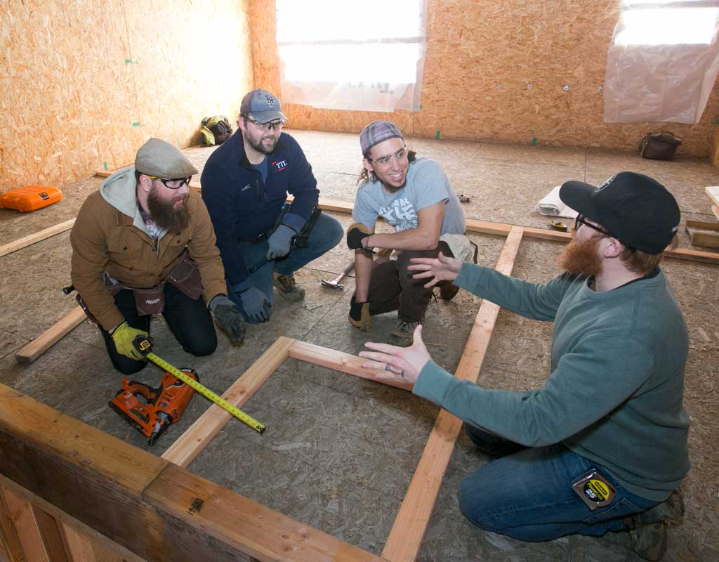 Students building framework for new classroom