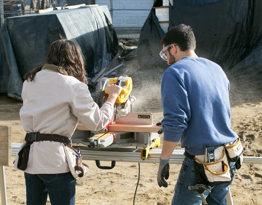 PTSEM students using a power saw