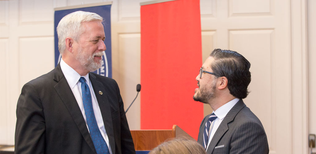 President Barnes speaking with Eugene Cho, recipient of the 2017 Distinguished Alumni Award