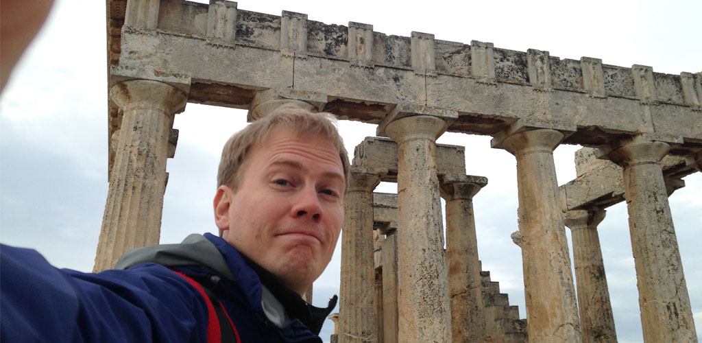 Dr. Micah Kiel in front of the temple to Aphaia on the island of Aegina in Greece