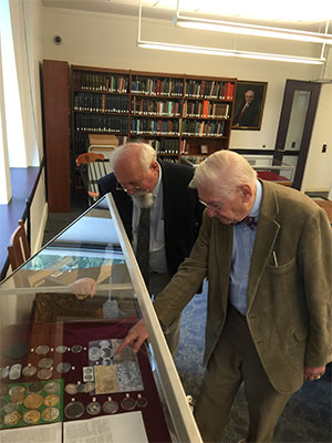 Frederick J. Schumacher (right) pictured with Kenneth Woodrow Henke, curator of special collections and archivist of the Numismatic Luther Exhibit