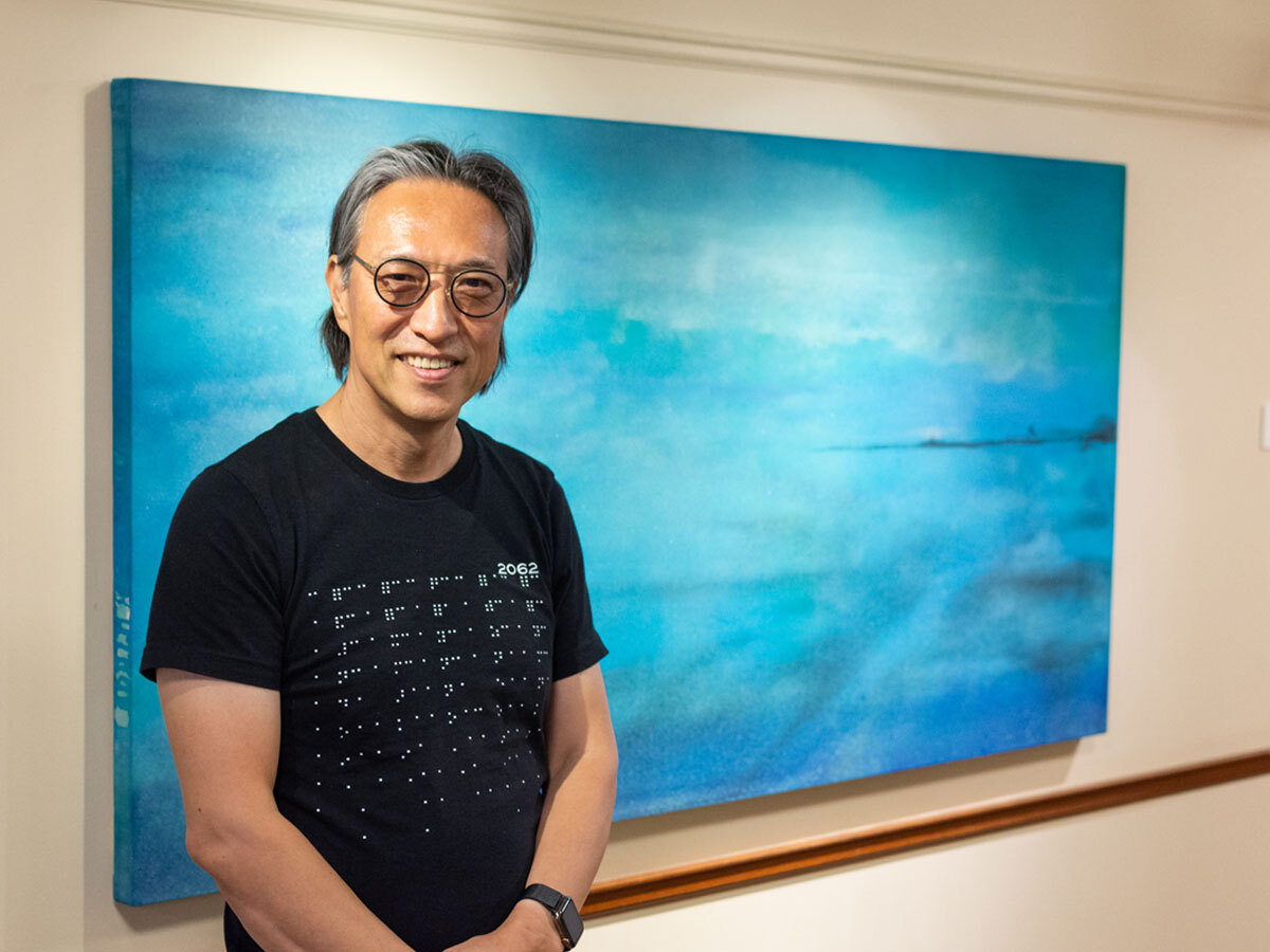 Makoto Fujimura poses with his painting "New Vista," created for the Seminary's gallery space. Artwork © 2022 Makoto Fujimura