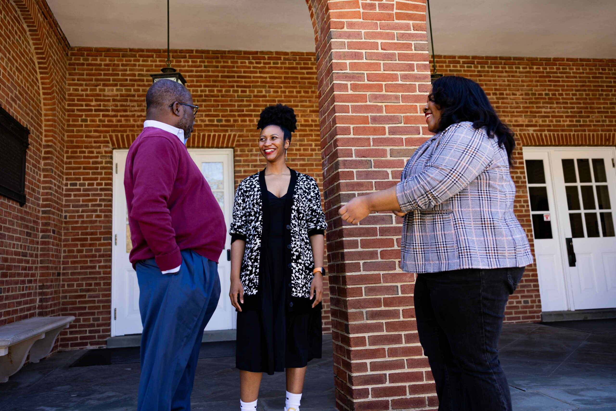 David Lattimore speaks with two students