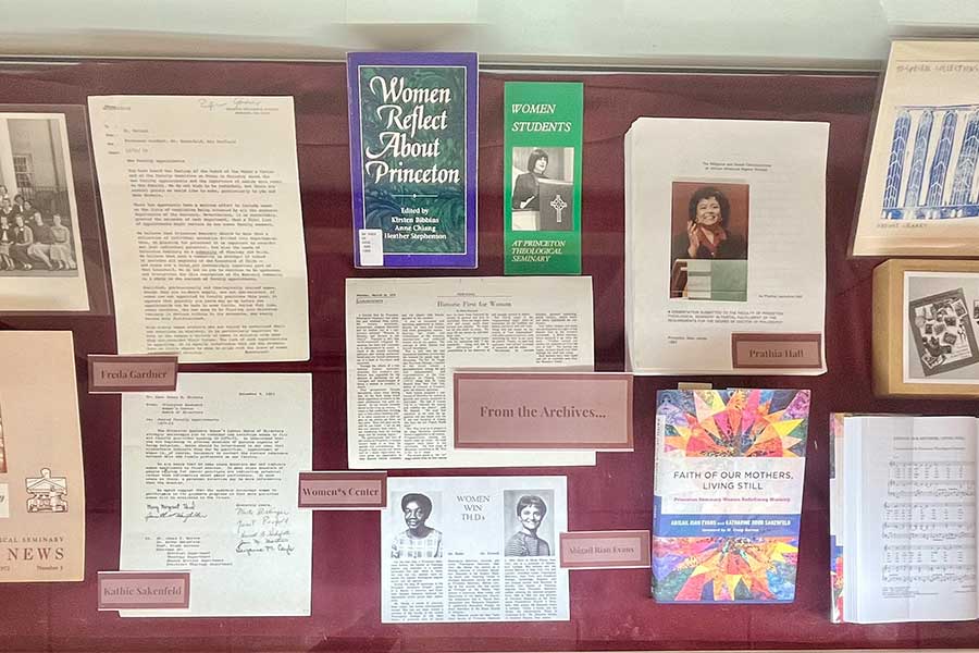 glass exhibit case with some photos and printed materials from the Princeton Theological Seminary Archives from and about women’s participation in theological work and the church