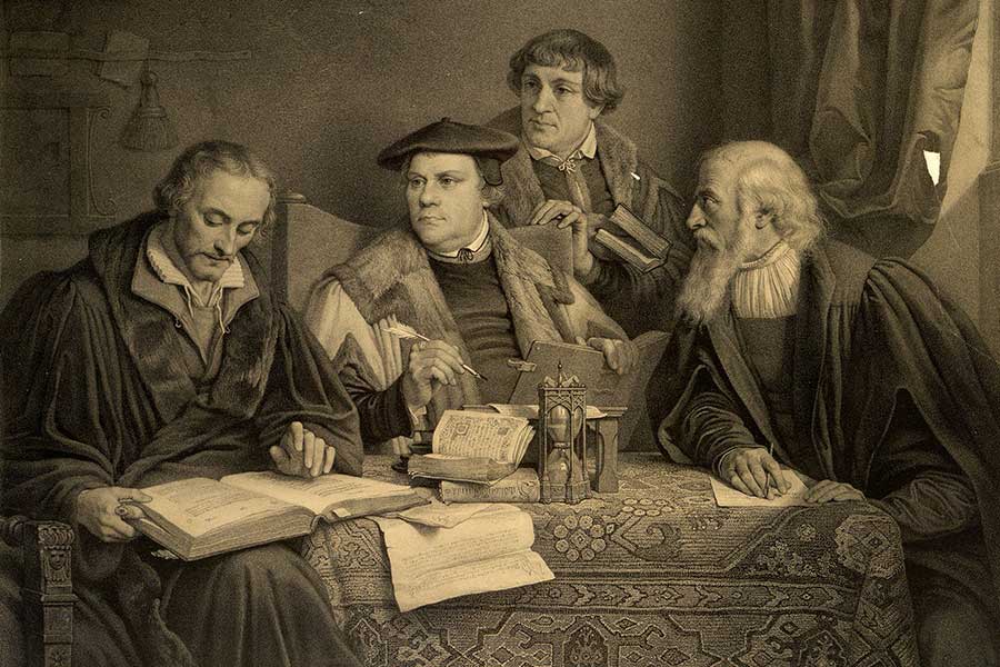Philipp Melanchthon (left), Martin Luther (center), Johann Bugenhagen (aka Pomeranus, second from right), and Caspar Cruciger (right) translate the Bible. Lithograph by Alphonse Léon Noël from a painting by Pierre-Antoine Labouchère, ca. 1846. [Image no. 4433] from https://www.history.pcusa.org/history-online/exhibits/foundations-faith-page-1
